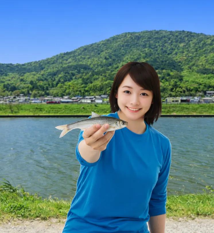 長命寺川でモロコの釣果を得た女性.webp